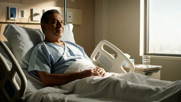 aimee engaging with a patient at the bedside